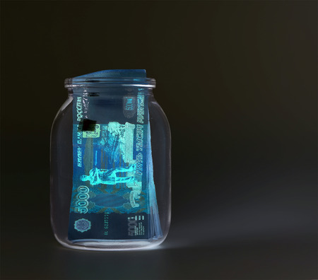 Russian banknotes--Five Thousand Ruble Notes in a glass jar (in UV light protection )の写真素材