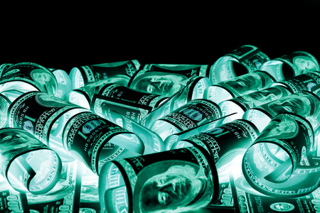 One hundred dollar bills (banknotes )  close up, U.S. currency-- in UV light protectionの写真素材