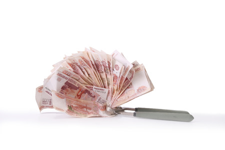 Allegory of the global financial crisis - the Russian Ruble in the grip of economic crisis, on a white backgroundの写真素材