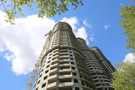 multi-storey building under construction, high multi-storey future house for many families and new...