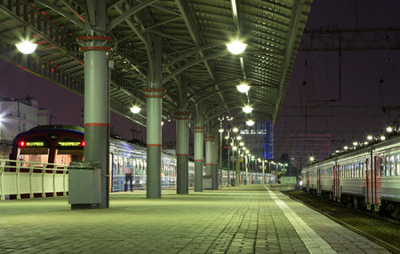 Train on Moscow passenger platform (Savelovsky railway station) is one of the nine main railway stations in Moscow, Russia (at night)のeditorial素材
