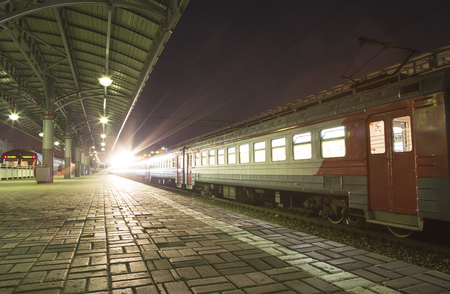 Train on Moscow passenger platform (Savelovsky railway station) is one of the nine main railway stations in Moscow, Russia (at night)のeditorial素材