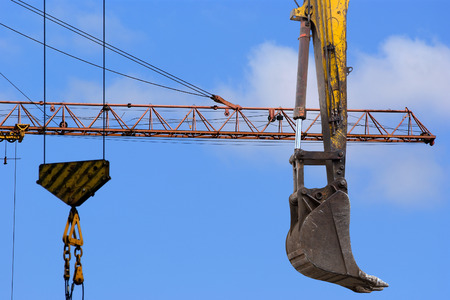 Construction machinery, high and heavy construction machinery  on the sky with cloudsの写真素材