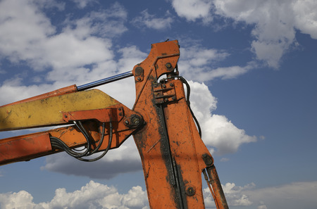 Construction machinery, high and heavy construction machinery  on the sky with cloudsの写真素材