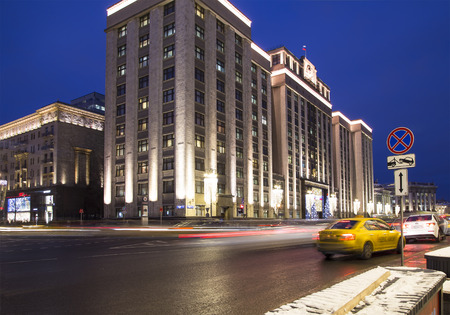 Christmas (New Year) holidays illumination and Building of The State Duma of the Federal Assembly of Russian Federation (inscription in Russian) at night, Moscow, Russiaのeditorial素材