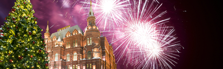 Fireworks over the Christmas (New Year holidays) illumination and State Historical Museum (inscription in Russian) at night, near the Kremlin  in Moscow, Russia   のeditorial素材