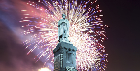 Fireworks over the Moscow city center and a monument to Pushkin on Tverskaya Street at night, Russia     の写真素材