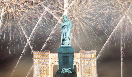 Fireworks over the Moscow city center and a monument to Pushkin on Tverskaya Street at night, Russia     の写真素材