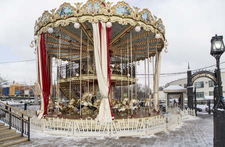Old classic French vintage carousel in a holiday park. Moscow, Russia の写真素材