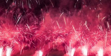 Celebratory colorful fireworks exploding in the skiesの写真素材