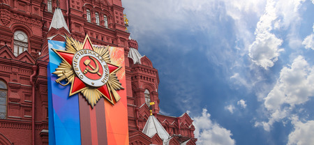 Banners with medals and ribbons on the facade of Historical museum (Victory Day decoration), Red Square, Moscow, Russiaのeditorial素材