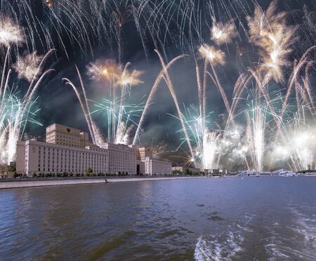 Main Building of the Ministry of Defence of the Russian Federation-- is the governing body of the Russian Armed Forces and celebratory colorful fireworks exploding in the skies. Moscow, Russiaの写真素材