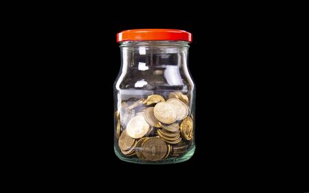 Iron 10 rubles coins (written ten rubles, the Bank of Russia in the Russian) over black backgroundの写真素材