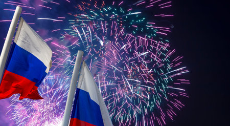 Russia flag waving in the wind and fireworks in honor of Victory Day celebration (WWII), Moscow,...