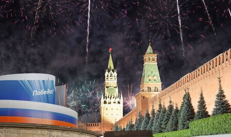 Moscow Kremlin and fireworks in honor of Victory Day celebration (WWII),  Red Square, Moscow, Russia.  English translation from Russian: Victory!の写真素材