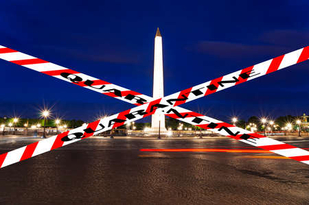Coronavirus in Paris, France. Quarantine sign. Concept of COVID pandemic and travel in Europe. Place de la Concorde and  Obelisk of Luxor at nightのeditorial素材