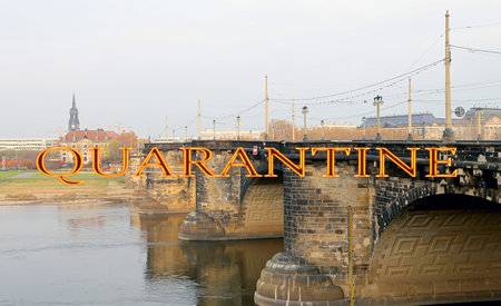 Coronavirus in Dresden, Germany. View of bridge over Elbe river. Quarantine sign. Concept of COVID...