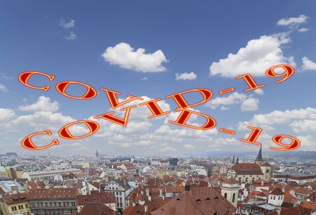 Coronavirus in Prague, Czech Republic. Cityscape of Prague from above. Covid-19 sign. Concept of COVID pandemic and travel in Europe.の写真素材