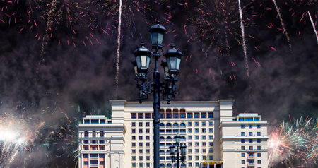 Fireworks over the facade of Four Seasons hotel (Hotel Moskva) from Manege Square. Moscow, Russia