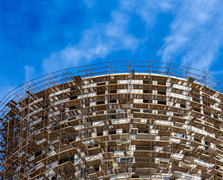 Multi-storey building under construction with scaffolding (new residential complex), Moscow, Russia