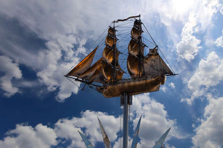 Brig Mercury (two-masted sailboat) against the sky - Monument of the black sea sailors (opened in September 2003, sculptor Andrey Kovalchuk), Nakhimovsky prospekt, Moscow, Russiaのeditorial素材