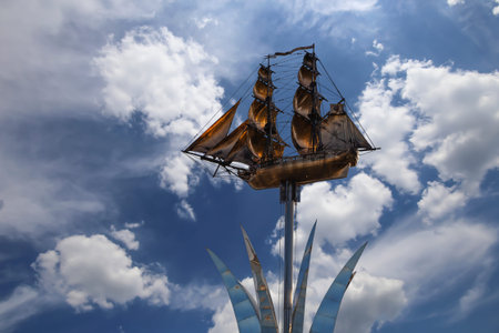 Brig Mercury (two-masted sailboat) against the sky - Monument of the black sea sailors (opened in...