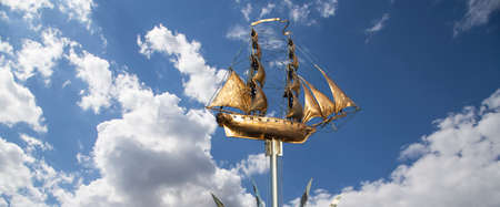 Brig Mercury (two-masted sailboat) against the sky - Monument of the black sea sailors (opened in September 2003, sculptor Andrey Kovalchuk), Nakhimovsky prospekt, Moscow, Russiaのeditorial素材