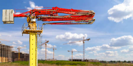 Construction concrete pump (pump truck) on the background construction site, industrial image. Moscow, Russiaのeditorial素材