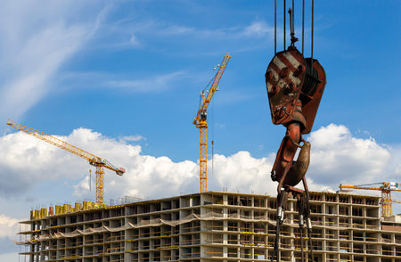 Part of a construction machine (excavator or crane) on the background construction site, industrial...