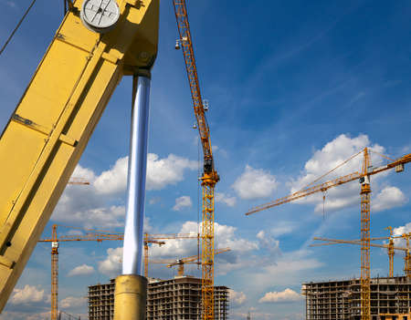 Part of a construction machine (excavator or crane) on the background construction site, industrial image. Moscow, Russiaのeditorial素材