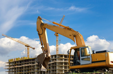 Construction machine (excavator) on the background construction site, industrial image. Moscow,...