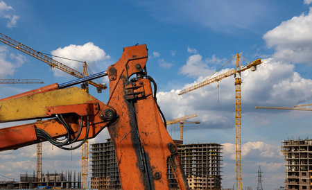 Part of a construction machine (excavator or crane) on the background construction site, industrial...