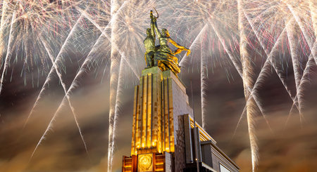 Celebratory colorful fireworks and soviet monument Rabochiy i Kolkhoznitsa (Worker and Kolkhoz Woman or Worker and Collective Farmer) of sculptor Vera Mukhina, Moscow, Russia. Made of in 1937のeditorial素材