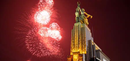 Celebratory colorful fireworks and soviet monument Rabochiy i Kolkhoznitsa (Worker and Kolkhoz Woman or Worker and Collective Farmer) of sculptor Vera Mukhina, Moscow, Russia. Made of in 1937のeditorial素材