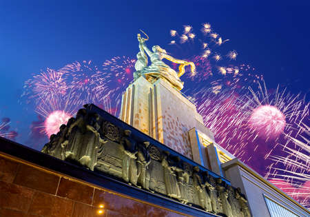 Celebratory colorful fireworks and soviet monument Rabochiy i Kolkhoznitsa (Worker and Kolkhoz Woman or Worker and Collective Farmer) of sculptor Vera Mukhina, Moscow, Russia. Made of in 1937のeditorial素材