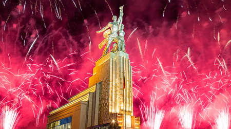 Celebratory colorful fireworks and soviet monument Rabochiy i Kolkhoznitsa (Worker and Kolkhoz Woman or Worker and Collective Farmer) of sculptor Vera Mukhina, Moscow, Russia. Made of in 1937のeditorial素材