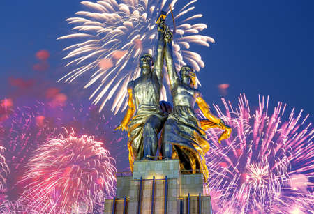 Celebratory colorful fireworks and soviet monument Rabochiy i Kolkhoznitsa (Worker and Kolkhoz Woman or Worker and Collective Farmer) of sculptor Vera Mukhina, Moscow, Russia. Made of in 1937のeditorial素材