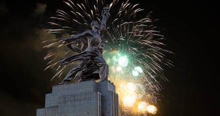 Celebratory colorful fireworks and soviet monument Rabochiy i Kolkhoznitsa (Worker and Kolkhoz Woman or Worker and Collective Farmer) of sculptor Vera Mukhina, Moscow, Russia. Made of in 1937のeditorial素材