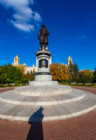 View of the monument to Mikhail Vasilyevich Lomonosov (autumn sunny day) from the side of the main building of Moscow State University (MSU) on Sparrow Hills, Russiaのeditorial素材