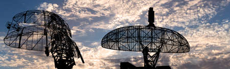 Air defense radars of military mobile anti aircraft systems, modern army industry on background beautiful clouds and sky, Russiaの写真素材