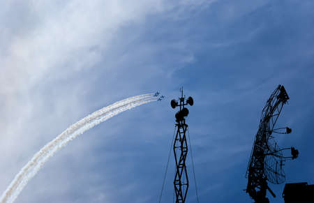 Air defense raiders of military mobile anti-aircraft complexes (radar is designed and automatic tracking of targets and missiles) against the background of the flight of modern combat fighters,Russiaの写真素材