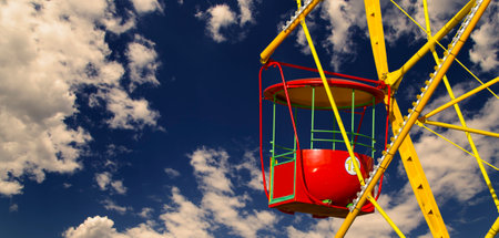 Attraction (carousel) ferris wheel against the background of a romantic evening skyの写真素材
