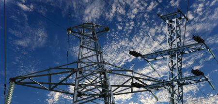 Electricity pylon (high voltage power line) on the background of the cloudy sky