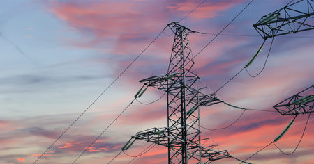 Electricity pylon (high voltage power line) against the background of a romantic evening sky