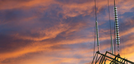 Electricity pylon (high voltage power line) against the background of a romantic evening sky