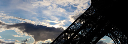Eiffel Tower against the background of a beautiful sky with clouds. Paris, France
