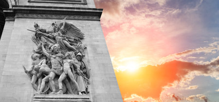 Arc de Triomphe (against the background of a sky at sunset), Paris, France. The walls of the arch are engraved with the names of 128 battles and names of 660 French military leaders (in French)の写真素材