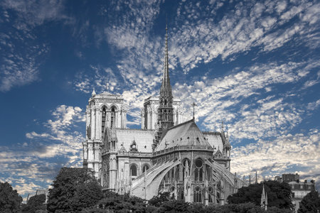 Notre Dame de Paris (against the background of sky with clouds), also known as Notre Dame Cathedral or simply Notre Dame, is a Gothic, Roman Catholic cathedral of Paris, Franceの写真素材
