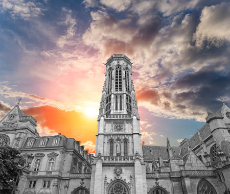 Great gothic church of Saint Germain l Auxerrois (against the background of a sky at sunset), Paris, Franceの写真素材