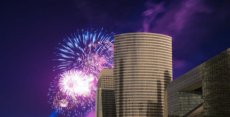 Celebratory fireworks over the Skyscrapers La Defense, commercial and business center of Paris,...